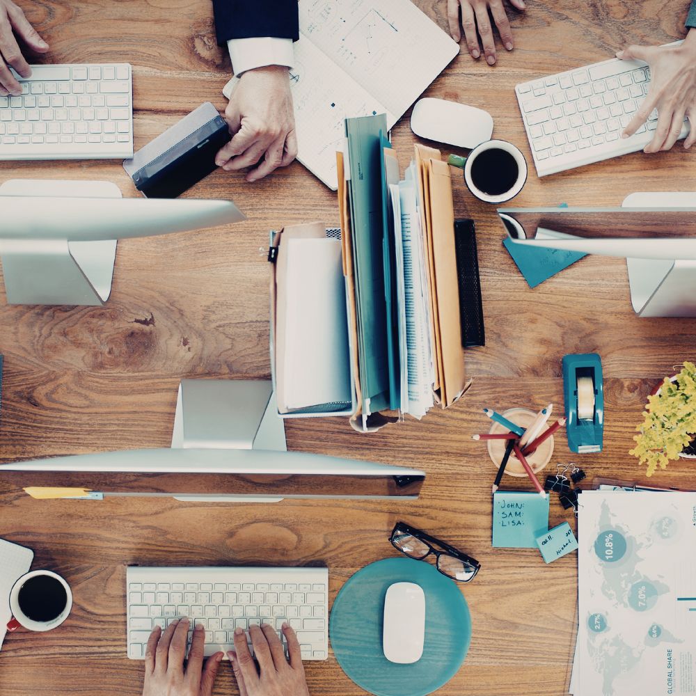 business-team-collaborating-marketing-strategy-round-table-meeting-with-analytics-charts